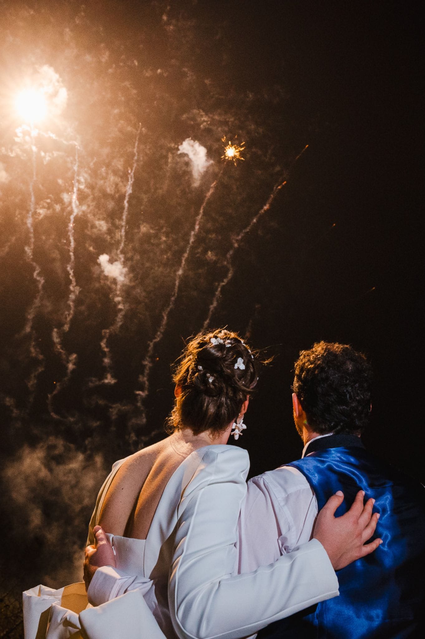 Fireworks going off as to celebrate the happy couple getting married 