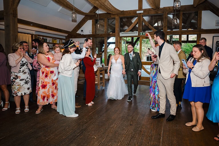 The newlyweds enter their wedding dance reception at Nancarrow Farm