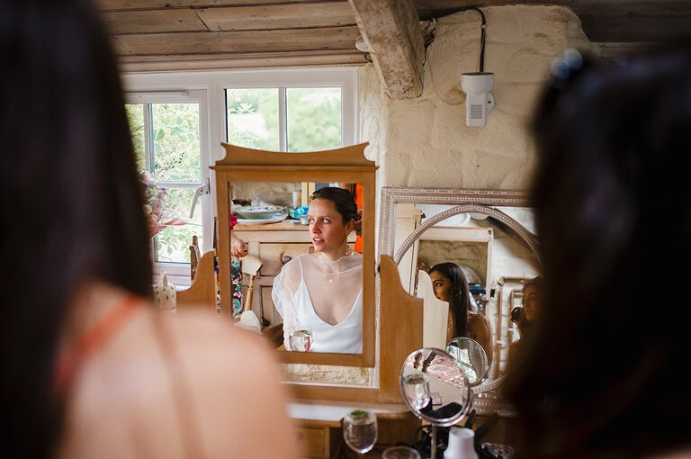 Brdie looking into a mirror