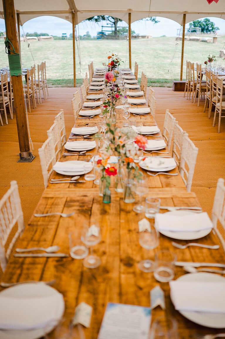 Table arrangements in a marquee wedding