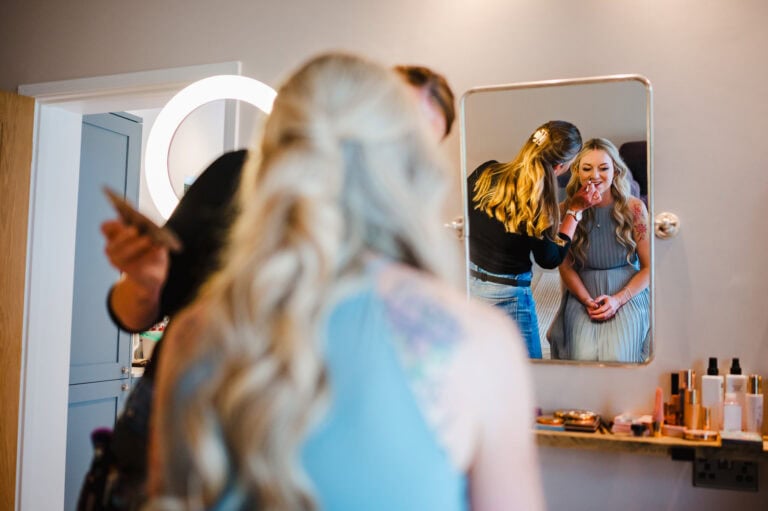 Wedding makeup in the mirror at Froginwell by Devon wedding photographer, Jake Timms Photography