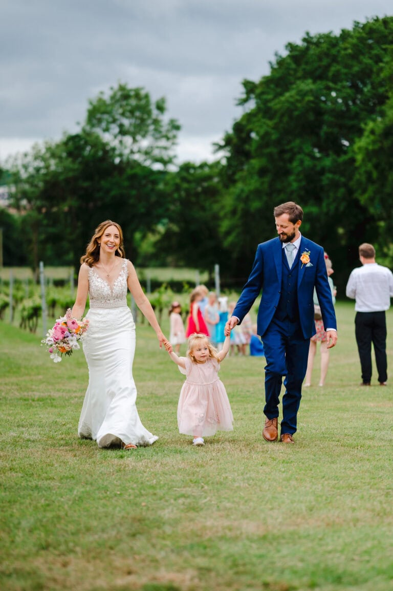 Walking as a family as they walk along the lawn at Froginwell