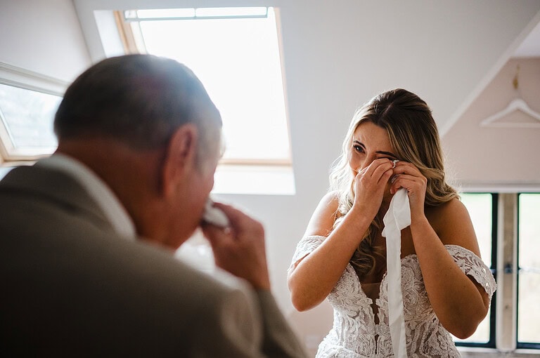 Tears are starting after they share an emotional hug - By Jake Timms Photography