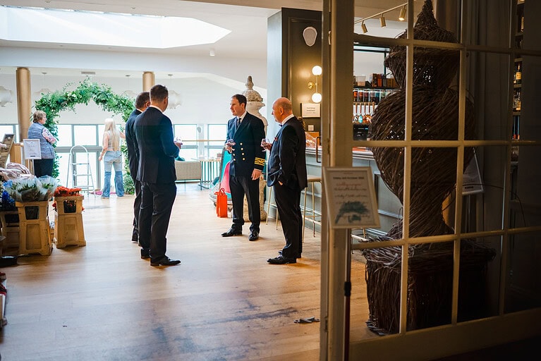 The groom and groomsmen waiting in the Polurrian for the wedding day